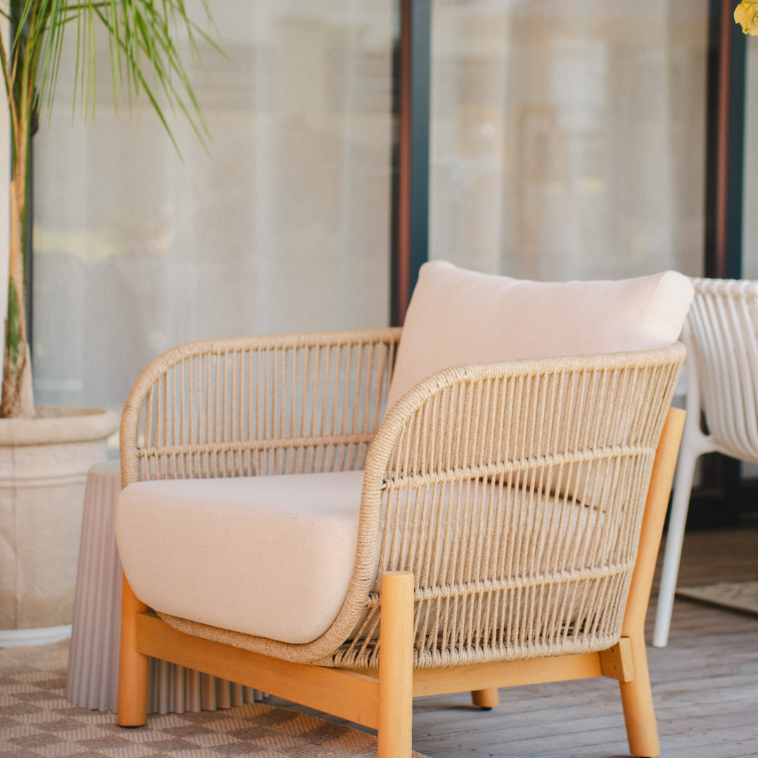Outdoor chairs with woven rope detailing and cushioned seat for a stylish patio setting