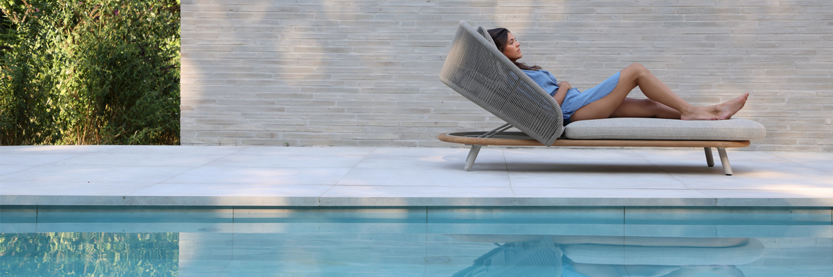 Luxury sun lounger by the pool with adjustable backrest for outdoor relaxation
