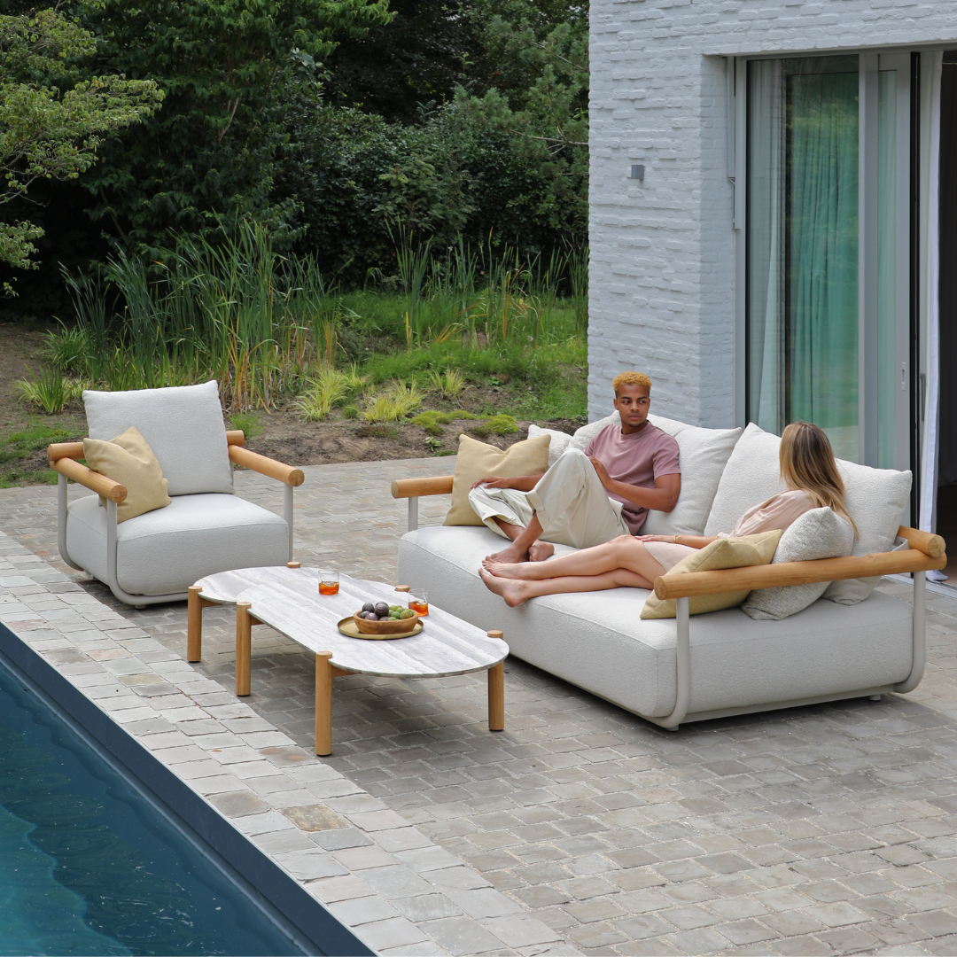 Pebl Orbit outdoor furniture styled on a wooden terrace, combining sculptural outdoor design with luxury outdoor comfort.