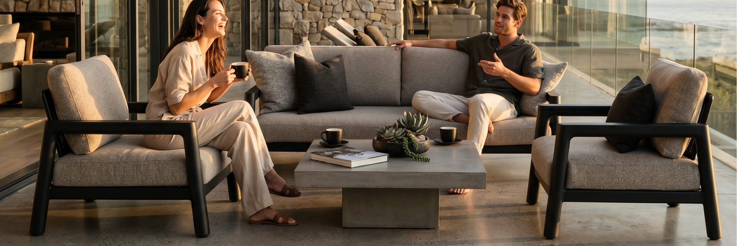 Friends dining around a modern outdoor patio set with table and chairs.